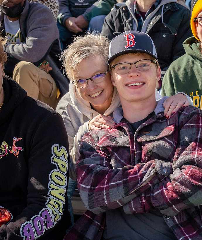 mother and son at homecoming football game