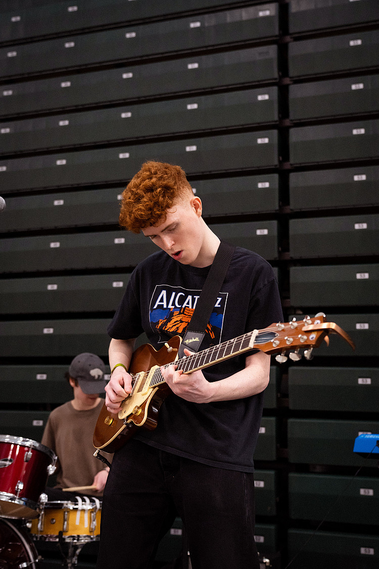 Student playing the guitar
