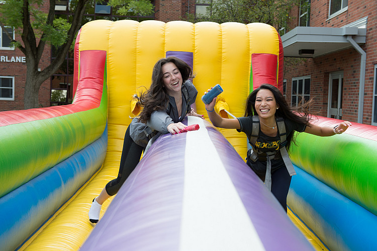 Students on an inflatable racing game