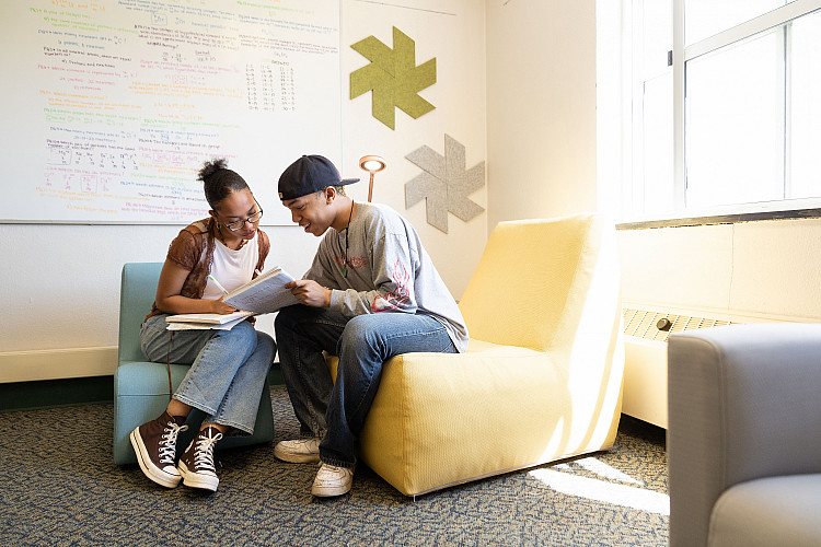 two students in a Wellness Room, located inside of the Residence Halls