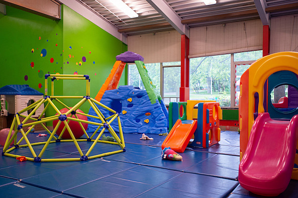 Climbing sets and playgrounds indoors on a blue mat