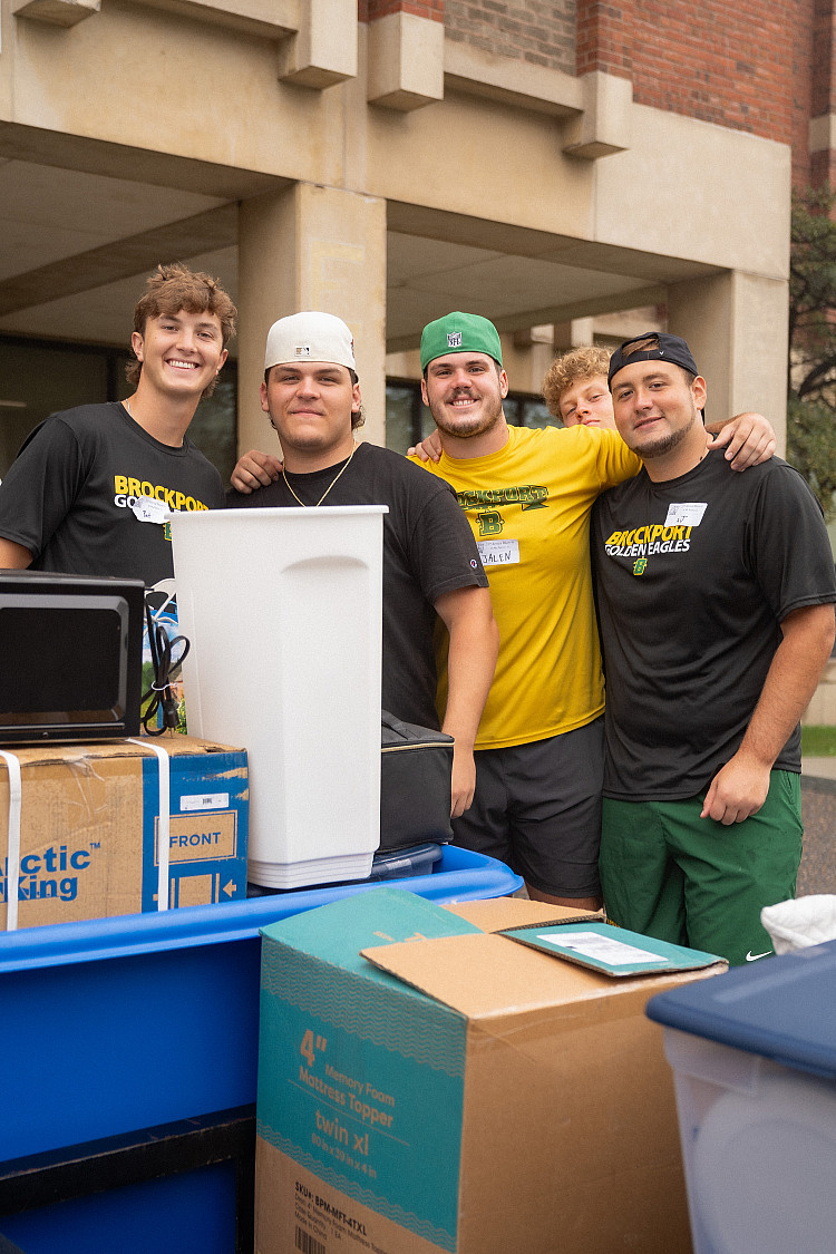 Four students helping with move-in