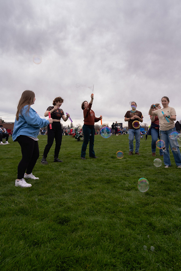 Students blowing bubbles
