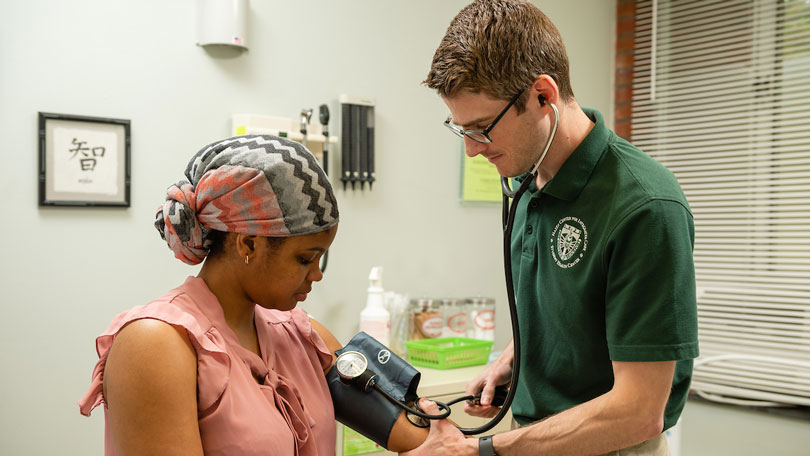 Student receiving a physical exam