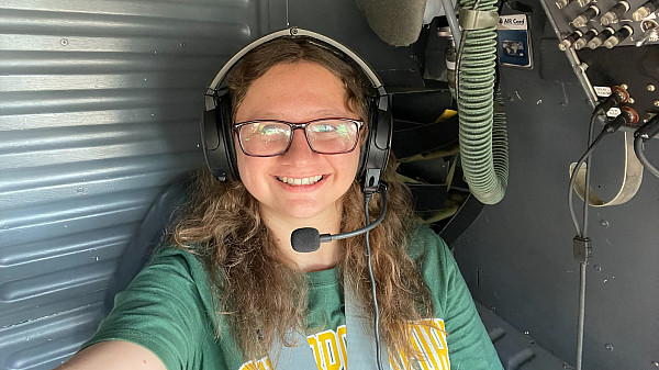 Hutton poses inside a NASA aircraft as part of summer internship program