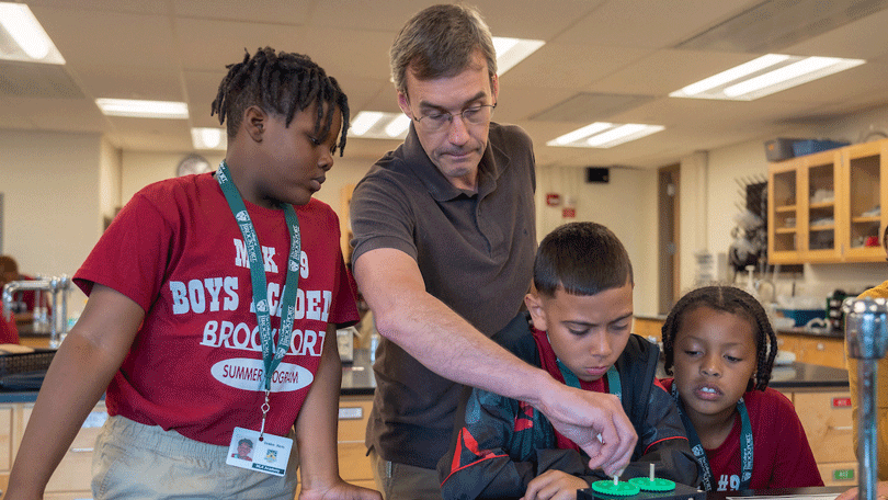 MLK Boys Academy students with assistant professor of chemistry Bob LeSeur.