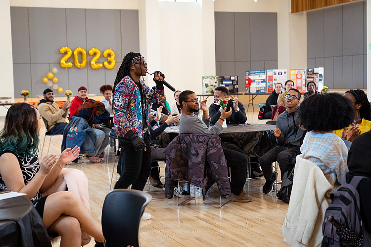Student giving a speech at the 2023 Umoja Ceremony in the Seymour Union Ballroom