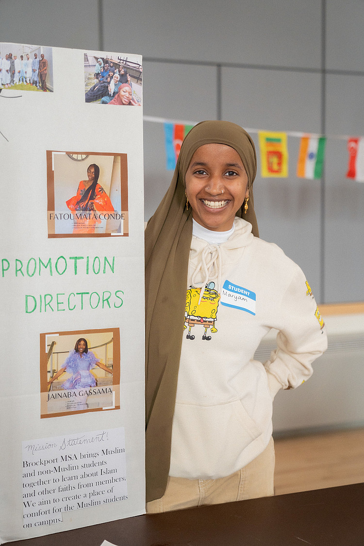 Photo of a student from a student organization tabling at a diversity event on campus