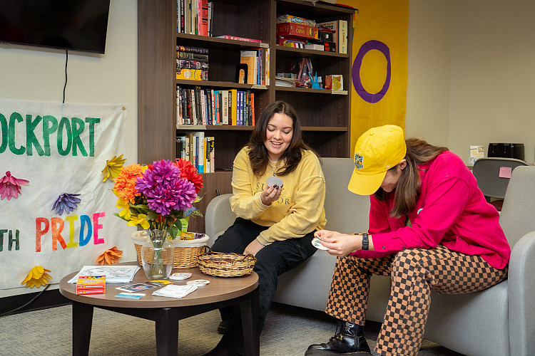 Students sitting on a couch in the Center for Gender and Sexual Diversity in the Seymour Union