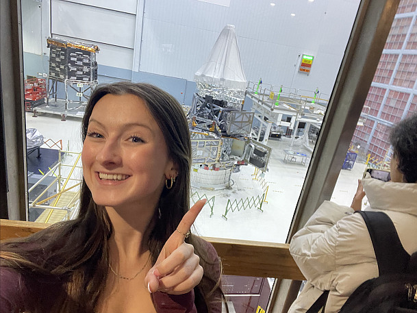 Physics major Allison Blum with the Nancy Grace Roman space telescope at NASA's Goddard Space Flight Center in January 2025.