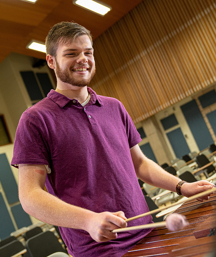 Student playing an instrument