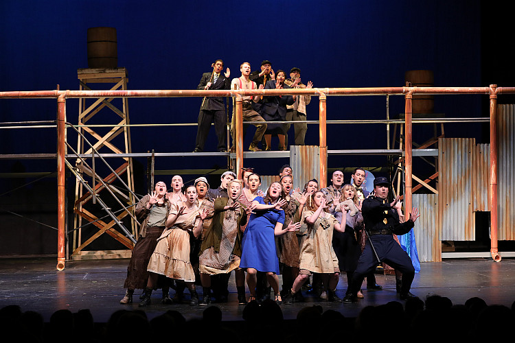 Students performing on stage