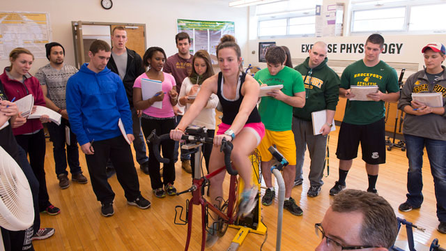 exercise science Student using exercise bike in Exercise Physiology Class
