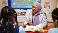 Albaram Kladigeh teaching an elementary reading class