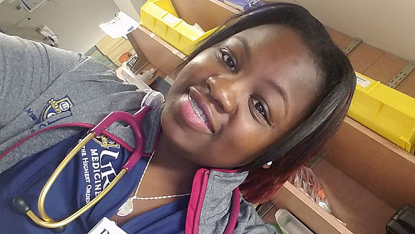 Aishia Wall at work in hospital with a stethoscope