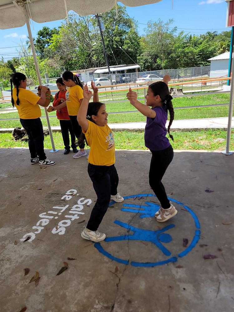 Two girls doing jumping jacks