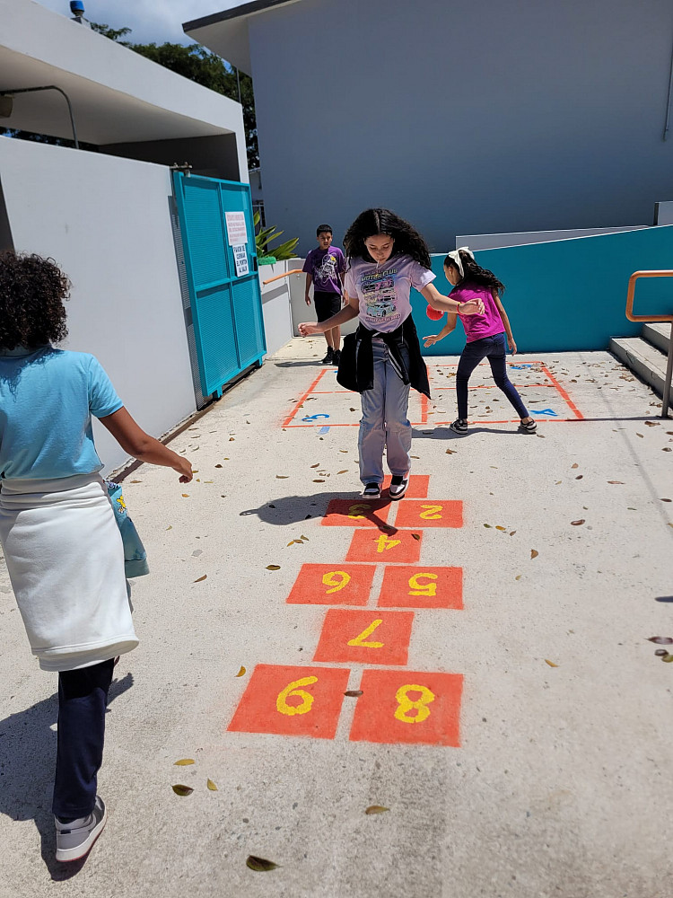 Girl doing hopscotch
